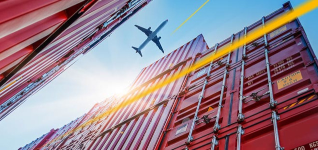 Aircraft flies over shipping container | LGI
