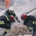 Earthquake helpers in ruins LGI