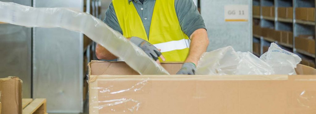 LGI worker packs goods | GLossary V