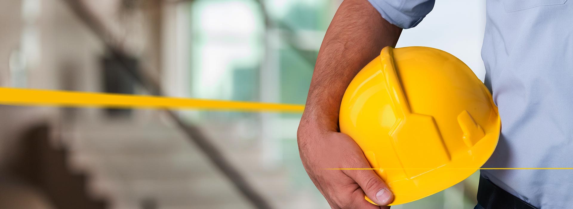 Person holds helmet in hand | LGI Safety Care