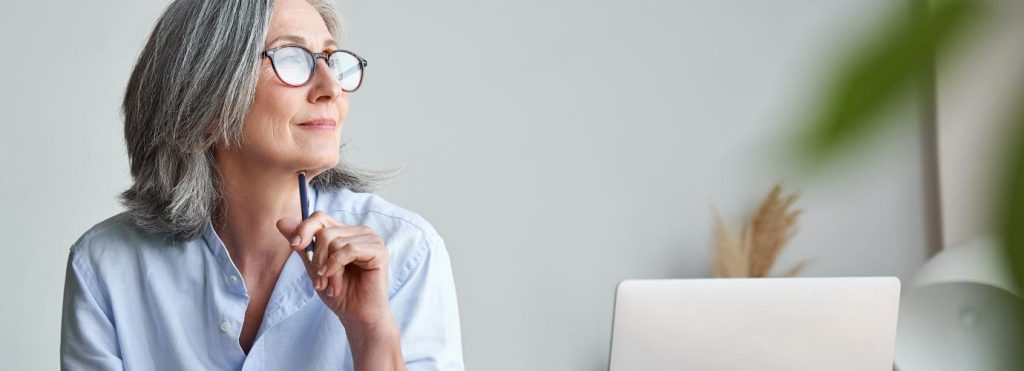 Woman on desk | LGI glossary A